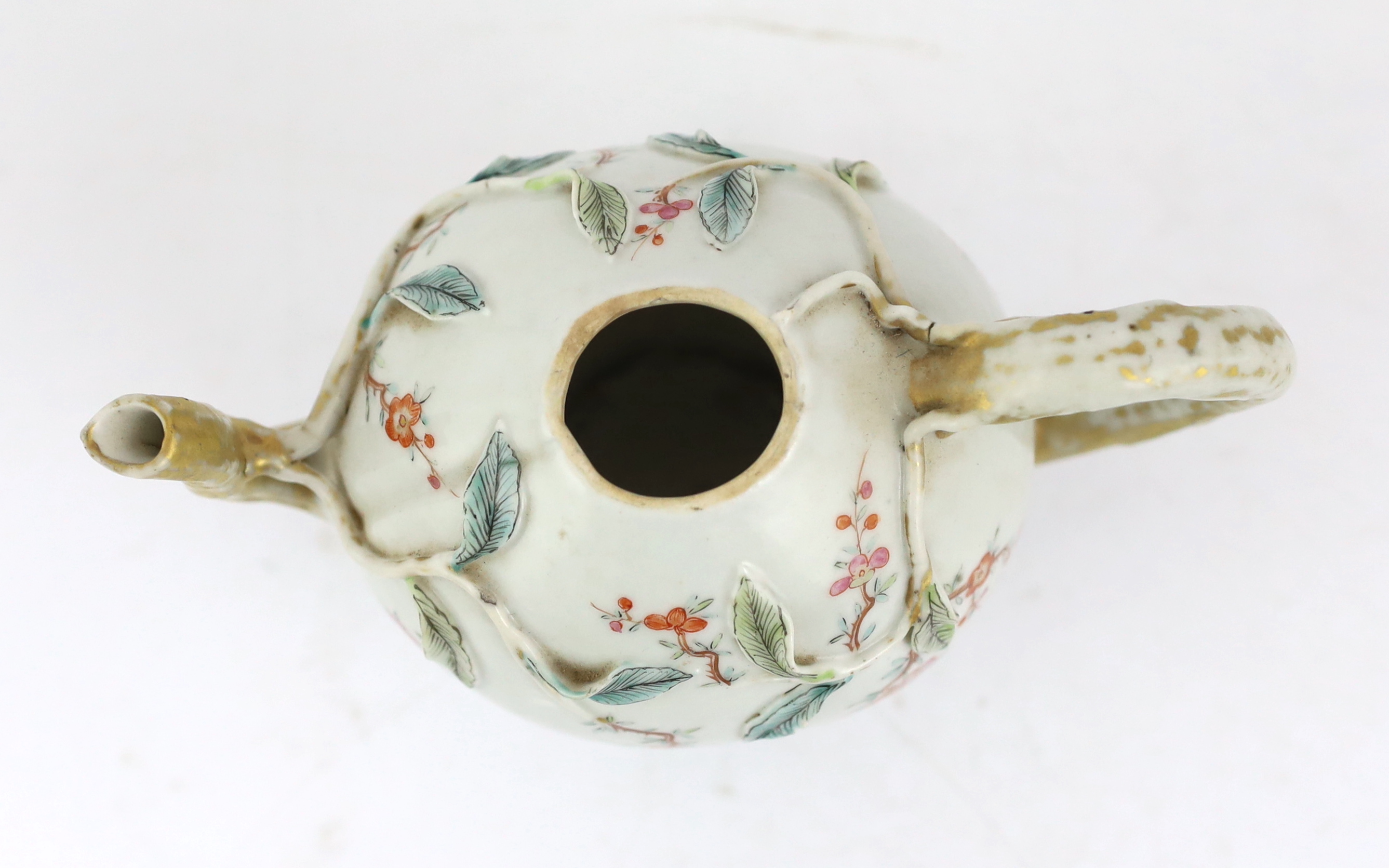 A Chinese enamelled porcelain peach-shaped teapot, Qianlong period (1736-95), wear to gilding